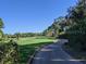 Landscaped path leading through lush golf course at 4410 Warren Ave # 403, Port Charlotte, FL 33953