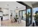 Bright dining area with glass table and sliding doors to patio at 48 Master Dr, Placida, FL 33946