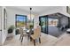 Dining area with glass table and sliding doors leading to the backyard at 48 Master Dr, Placida, FL 33946