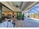 Spacious patio with access to pool and kitchen at 48 Master Dr, Placida, FL 33946