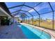 Inviting kidney-shaped pool with screened enclosure at 48 Master Dr, Placida, FL 33946