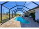 Relaxing kidney-shaped pool with screened enclosure at 48 Master Dr, Placida, FL 33946