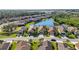 Aerial view of a luxury community with lakefront homes at 484 Casalino Dr, Nokomis, FL 34275