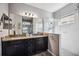 Double vanity bathroom with granite countertop and large shower at 484 Casalino Dr, Nokomis, FL 34275