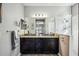 Double vanity bathroom with granite countertop and large shower at 484 Casalino Dr, Nokomis, FL 34275