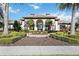 Community clubhouse with fountain and lush landscaping at 484 Casalino Dr, Nokomis, FL 34275