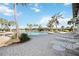 Resort-style community pool with lounge chairs and palm trees at 484 Casalino Dr, Nokomis, FL 34275