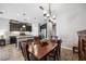 Dining area with kitchen views and a lovely chandelier at 484 Casalino Dr, Nokomis, FL 34275