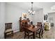 Bright dining room features a wood table, chairs, and a chandelier at 484 Casalino Dr, Nokomis, FL 34275