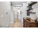 Bright and spacious entry hall with tile flooring and built-in shelving at 484 Casalino Dr, Nokomis, FL 34275