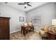 Home office with wood-look floors, desk, and comfortable armchair at 484 Casalino Dr, Nokomis, FL 34275