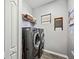 Laundry room with washer, dryer, and shelving at 484 Casalino Dr, Nokomis, FL 34275