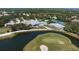 Aerial view of community with clubhouse, pool, and golf course at 523 Fallbrook Dr, Venice, FL 34292