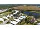 Aerial view of a home with a pool, in a residential community at 523 Fallbrook Dr, Venice, FL 34292