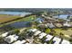 Bird's eye view of a house with a pool, near a golf course at 523 Fallbrook Dr, Venice, FL 34292