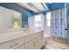 Bathroom with tub shower combo and coastal decor at 523 Fallbrook Dr, Venice, FL 34292