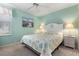 Bedroom with a queen bed and coastal decor at 523 Fallbrook Dr, Venice, FL 34292