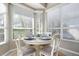 Charming breakfast nook with white table and gray chairs at 523 Fallbrook Dr, Venice, FL 34292