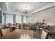 Elegant dining room with large windows and chandelier at 523 Fallbrook Dr, Venice, FL 34292