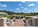 Relaxing fire pit area with chairs, overlooking a golf course at 523 Fallbrook Dr, Venice, FL 34292