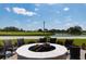 Round fire pit surrounded by comfortable seating at 523 Fallbrook Dr, Venice, FL 34292