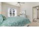 Main bedroom with king bed and sliding door access at 523 Fallbrook Dr, Venice, FL 34292