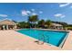 Resort-style community pool with plenty of lounge chairs at 523 Fallbrook Dr, Venice, FL 34292