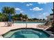 Relaxing community pool and spa with ample seating at 523 Fallbrook Dr, Venice, FL 34292