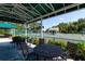 Covered seating area overlooking tennis courts at 523 Fallbrook Dr, Venice, FL 34292