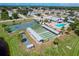 Aerial view of community with pool, tennis court, shuffleboard at 545 Foxwood Blvd # 23, Englewood, FL 34223