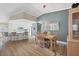 Bright dining area with wood table and chairs, adjacent to kitchen at 545 Foxwood Blvd # 23, Englewood, FL 34223