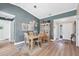 Light and airy dining room with wood table and chairs, near entryway at 545 Foxwood Blvd # 23, Englewood, FL 34223