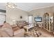 Living room with neutral-toned furniture and large windows at 545 Foxwood Blvd # 23, Englewood, FL 34223