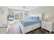 Spacious main bedroom with king-size bed and plenty of natural light at 545 Foxwood Blvd # 23, Englewood, FL 34223