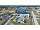 Beautiful aerial perspective of the community amenities: pool, tennis, shuffleboard and lake at 6543 Coliseum Blvd, Port Charlotte, FL 33981