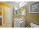 This bathroom has a vanity with a mirror and view of the bedroom and commode at 6543 Coliseum Blvd, Port Charlotte, FL 33981