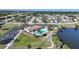 Aerial view of community pool nestled by a lake at 6543 Coliseum Blvd, Port Charlotte, FL 33981