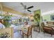 Bright dining area with patio access, tile floors, and open layout to the living room and kitchen at 6543 Coliseum Blvd, Port Charlotte, FL 33981