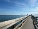 Scenic view of pier extending over the water, offering access to beautiful coastal views at 6543 Coliseum Blvd, Port Charlotte, FL 33981