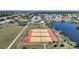 Overhead view of the tennis courts available for community residents by the lake at 6543 Coliseum Blvd, Port Charlotte, FL 33981