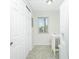 Bright hallway with closet and room for a small dining table at 6800 Placida Rd # 122, Englewood, FL 34224