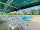 Community pool with seating areas, ideal for relaxation and socializing at 6800 Placida Rd # 122, Englewood, FL 34224