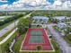 Aerial view of community tennis courts offering a great recreational amenity at 6800 Placida Rd # 122, Englewood, FL 34224