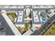 Aerial view of condo complex highlighting pool, parking, and building arrangement at 708 Tamiami S Trl # 103, Venice, FL 34285