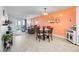 Charming dining area with coral-toned walls at 708 Tamiami S Trl # 103, Venice, FL 34285