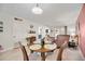 Bright dining area with wooden table and chairs at 708 Tamiami S Trl # 103, Venice, FL 34285