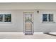 Unit entrance with a welcoming doormat at 708 Tamiami S Trl # 103, Venice, FL 34285