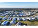 Wide aerial view of the community and surrounding landscape at 717 Tangerine Woods Blvd, Englewood, FL 34223