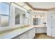 Bathroom with vanity, sink, and large mirror at 717 Tangerine Woods Blvd, Englewood, FL 34223