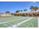 Outdoor shuffleboard courts with covered seating areas at 717 Tangerine Woods Blvd, Englewood, FL 34223